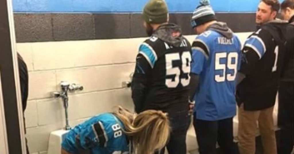 Female Carolina Panthers Fan Takes A Squat, Sits & Pees Into Men’s
