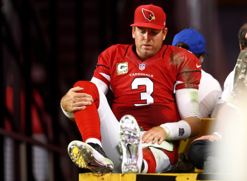 Nov 9, 2014; Glendale, AZ, USA; Arizona Cardinals quarterback Carson Palmer reacts as he is taken off the field on a cart after suffering an injury in the second half against the St. Louis Rams at University of Phoenix Stadium. The Cardinals defeated the Rams 31-14. Mandatory Credit: Mark J. Rebilas-USA TODAY Sports ORG XMIT: USATSI-180298 ORIG FILE ID:  20141109_mjr_su5_035.JPG