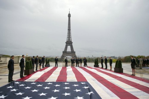 Student officers display a US giant national flag on the Trocadero square with the Eiffel tower in the background during a solemn tribute to the victims of the 9/11 attacks on September 11, 2011 in Paris. Several commemorations are held in France today to mark the 10th anniversary of the 9/11 attacks which killed almost 3,000 people in NYC and Washington and plunged the US into an era of war. AFP PHOTO / FRED DUFOUR (Photo credit should read FRED DUFOUR/AFP/Getty Images)
