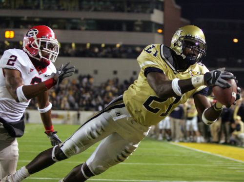 ** FILE ** Georgia Tech's Calvin Johnson (21) makes a touchdown catch as Georgia's DeMario Minter (2) defends during the first quarter Saturday, Nov. 26, 2005, in Atlanta. (AP Photo/John Bazemore)