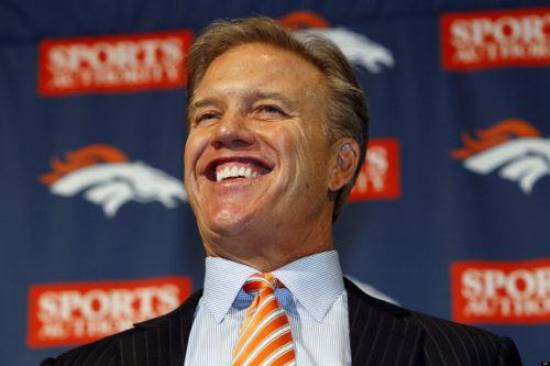 Denver Broncos executive vice president of football operations John Elway jokes with reporters during an NFL football news conference introducing new quarterback Peyton Manning at the team's headquarters in Englewood, Colo., on Tuesday, March 20, 2012. (AP Photo/David Zalubowski)