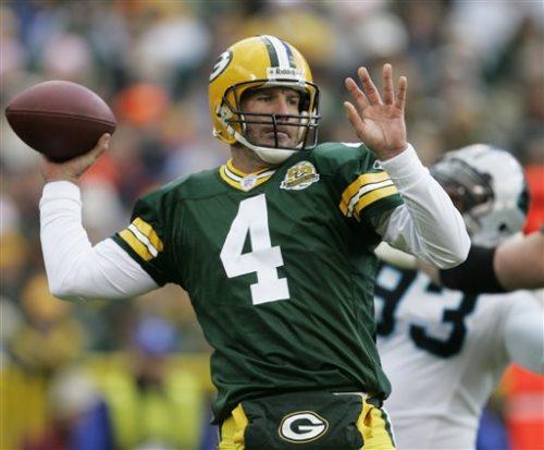 Green Bay Packers quarterback Brett Favre drops back to pass during the first half of an NFL football game against the Carolina Panthers Sunday, Sept. 18, 2007, in Green Bay, Wis. (AP Photo/Morry Gash)