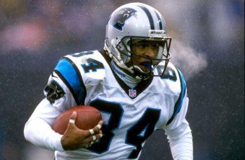 F361998 01: FILE PHOTO: National Football League wide receiver Rae Carruth, who is facing murder charges in the drive-by shooting of his pregnant girlfriend, was arrested on Wednesday when found hiding in the trunk of a car in a hotel parking lot in Tennessee, a police spokesman said. Carruth of the Carolina Panthers is seen in this November 9, 1997 photo during a game against the Denver Broncos at Mile High Stadium in Denver, Colorado. (Photo by Brian Bahr/Allsport/Liaison Agency)