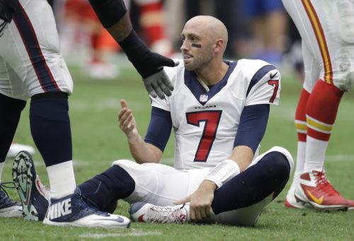 Houston Texans' Brian Hoyer (7) sits on the turf after he lost his helmet when he was sacked during the first half of an NFL football game against the Kansas City Chiefs, Sunday, Sept. 13, 2015, in Houston. (AP Photo/Patric Schneider)