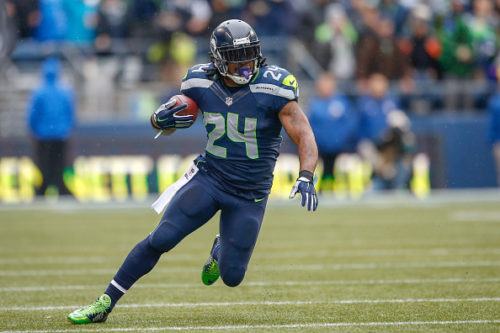 SEATTLE, WA - NOVEMBER 02: Running back Marshawn Lynch #24 of the Seattle Seahawks rushes against the Oakland Raiders at CenturyLink Field on November 2, 2014 in Seattle, Washington. (Photo by Otto Greule Jr/Getty Images)
