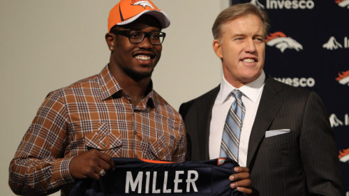 Von Miller of the Denver Broncos is presented to the media for the first time with vice president of football operations John Elway at Dove Valley on April 29, 2011 in Englewood, Colorado. Miller, a projected outside linebacker in head coach John Fox's new 4-3 scheme, was selected second overall from Texas A&M. (Photo by Justin Edmonds/Getty Images)