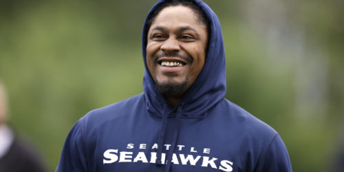 Seattle Seahawks' Marshawn Lynch walks off the field following a football minicamp practice that he watched from the sidelines Tuesday, June 17, 2014, in Renton, Wash. (AP Photo/Elaine Thompson)