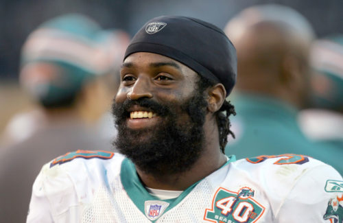 Miami Dolphins' Ricky Williams smiles in the final seconds of Miami's 33-21 win over the Oakland Raiders on Sunday, Nov. 27, 2005, in Oakland, Calif. (AP Photo/Marcio Jose Sanchez)
