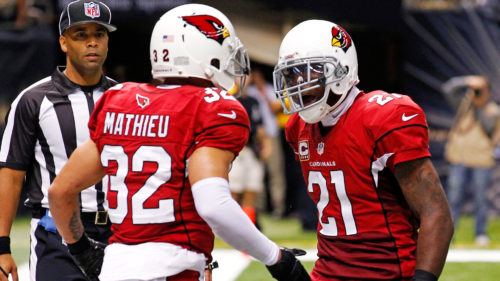Arizona Cardinals defensive back Tyrann Mathieu (32) celebrates with cornerback Patrick Peterson (21) after intercepting a pass in the end zone in the second half of an NFL football game against the New Orleans Saints in New Orleans, Sunday, Sept. 22, 2013. (AP Photo/Bill Haber)