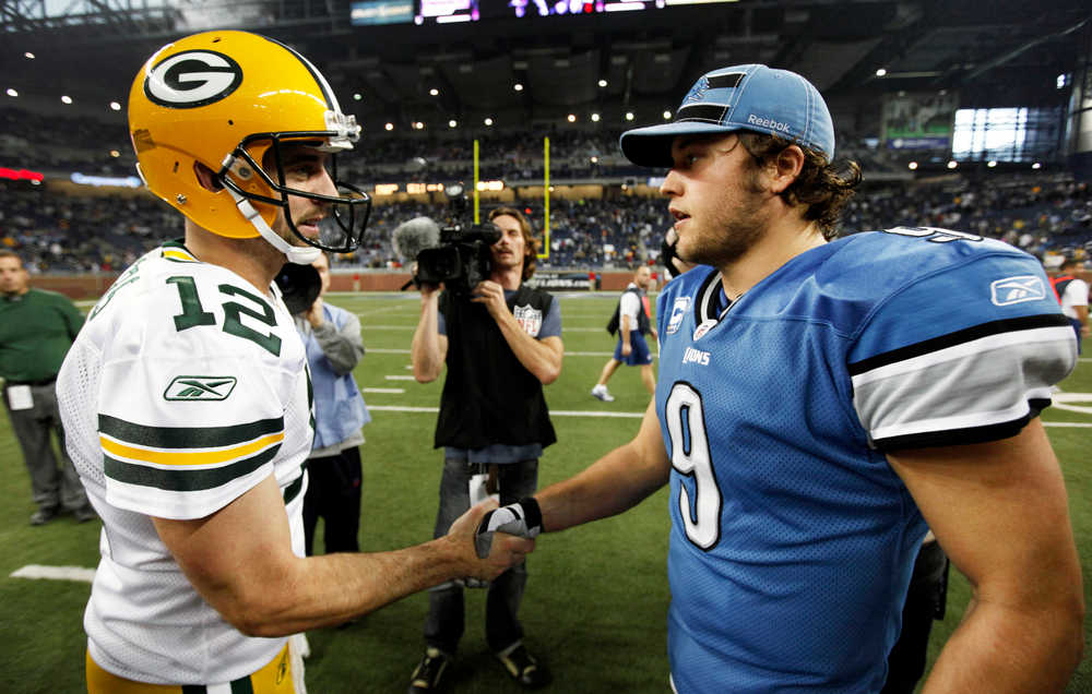 Green Bay Packers quarterback Aaron Rodgers (12) and Detroit Lions quarterback Matthew Stafford (9) shake hands after their NFL football game in Detroit on Thursday, Nov. 24, 2011. Green Bay won 27-15. (AP Photo/Paul Sancya)