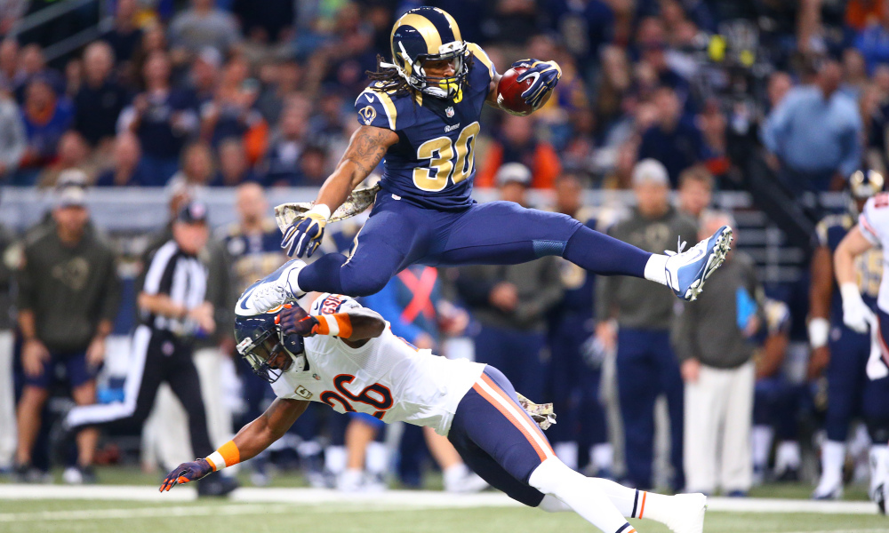 Nov 15, 2015; St. Louis, MO, USA; St. Louis Rams running back Todd Gurley (30) leaps over Chicago Bears strong safety Antrel Rolle (26) during the first half at the Edward Jones Dome. Mandatory Credit: Billy Hurst-USA TODAY Sports ORG XMIT: USATSI-224720 ORIG FILE ID: 20151115_lbm_hb2_111.JPG