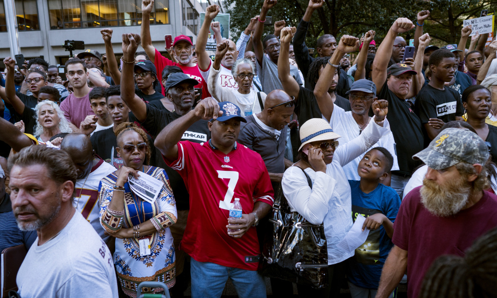 Colin Kaepernick supporters rally in protest at the LA Coliseum