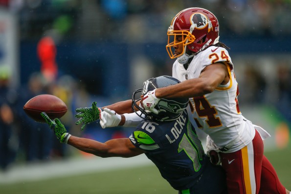 Landover, MD, USA. 23rd Sep, 2018. Washington Redskins CB #24 Josh Norman  tries to drag down Green Bay Packers TE #80 Jimmy Graham during a NFL  football game between the Washington Redskins