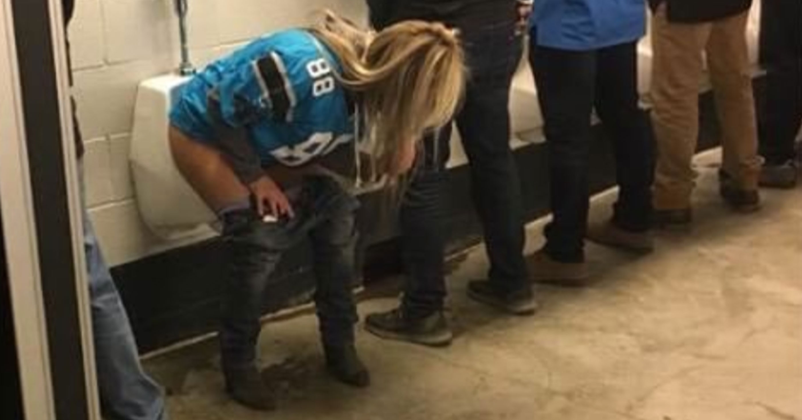 Female Carolina Panthers Fan Takes A Squat Sits Pees Into Mens