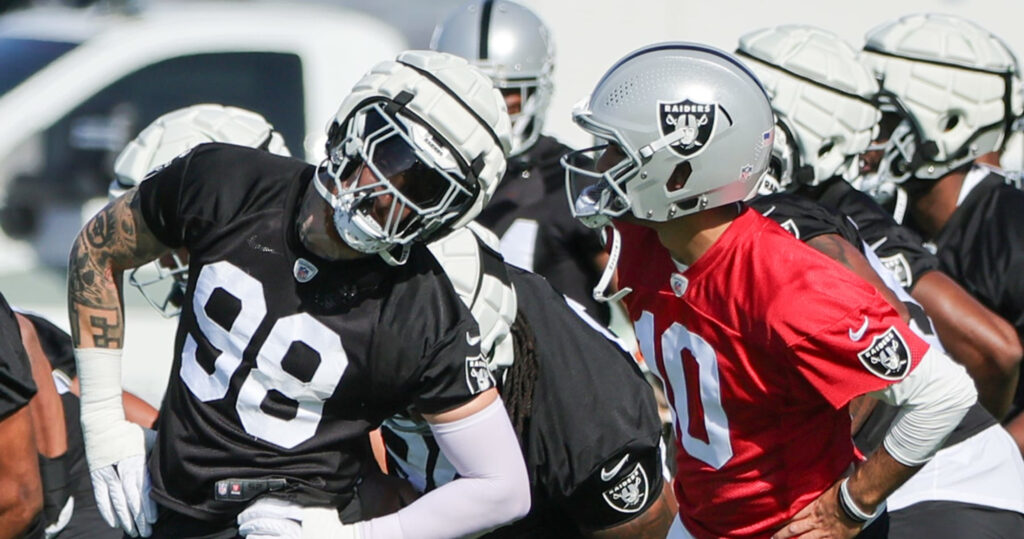 Raiders defensive end Maxx Crosby (98) shouts during the second